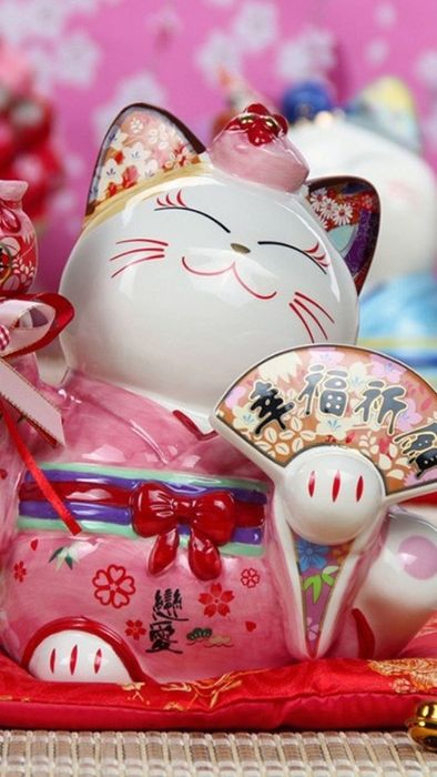 Mèo thần tài với nền màu hồng dễ thương