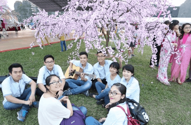 Young people gather at September 23 Park to participate in the cherry blossom event