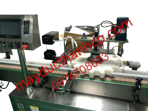 Máy chiết rót và cấp nắp tự động