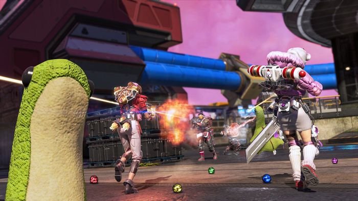 Một chiếc búp bê Nessie nhìn vào màn hình trong khi các nhân vật của Apex Legends mặc như những nhân vật yêu thích trong Final Fantasy 7 chiến đấu ở phía sau