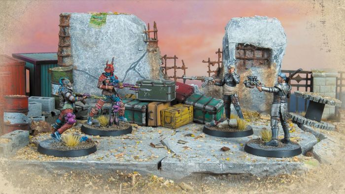Các mô hình từ các phe phái của Fallout đối đầu với nhau trên một chiến trường của các tòa nhà đổ nát