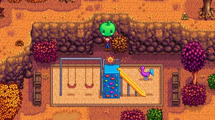 Người chơi Stardew Valley cầm một con búp bê Jumino trong một công viên chơi