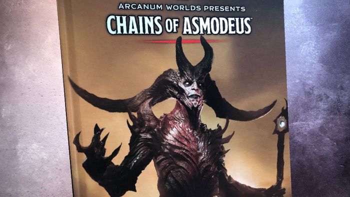 Bìa cuốn sách cứng Chains of Asmodeus trên nền xám