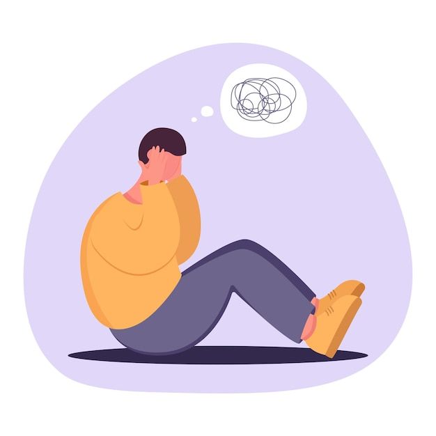 Hình ảnh người đàn ông đau khổ vì trầm cảm, ngồi trên sàn nhà, trạng thái loạn trí, rối rắm tư duy.