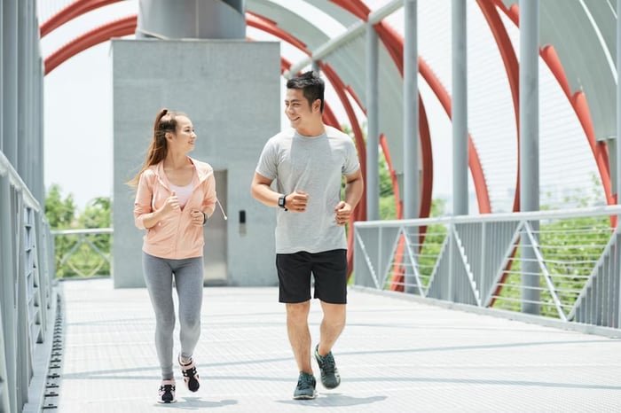 A couple is jogging together