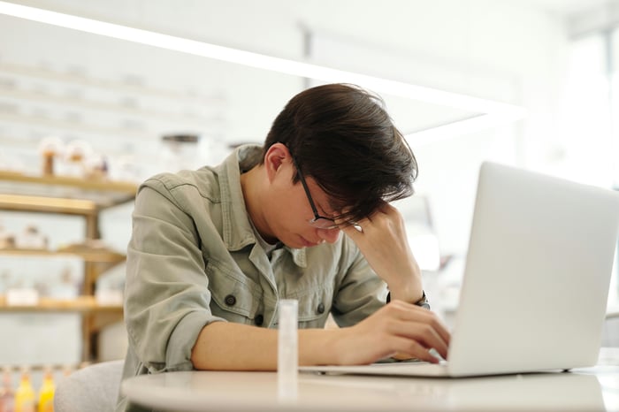 Free A Man Looking Ill while Working with His Laptop Stock Photo