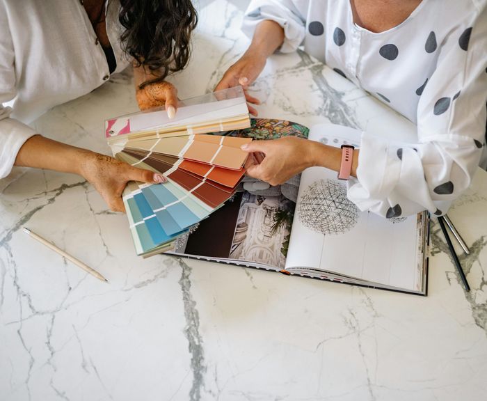 Free Women Holding a Sample Color Chart Stock Photo