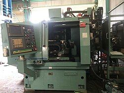 Máy mài phẳng CNC, còn được gọi là máy mài CNC dùng công nghệ CNC