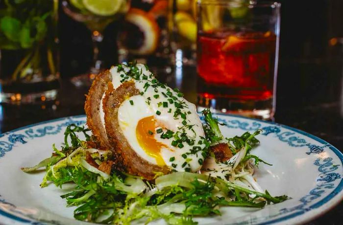 A plate showcasing a scotch egg.