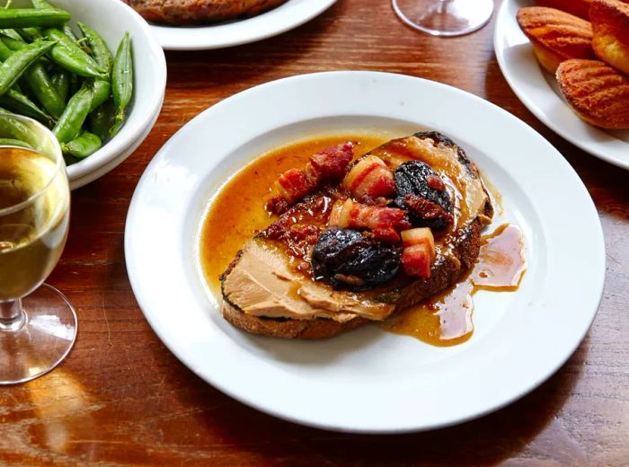 A table laden with an array of dishes and wine.