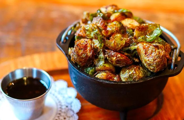 <div>
                
                  <div>A metal crock brimming with perfectly roasted Brussels sprouts.</div>
                </div>