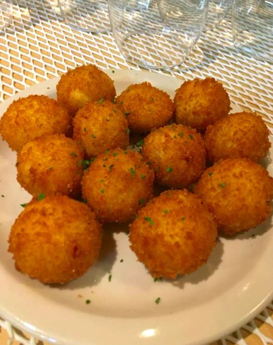 A plate piled with savory croquetas.