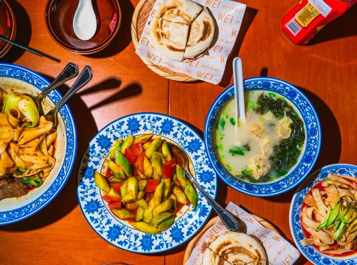 An assortment of dishes served on elegantly decorated plates.