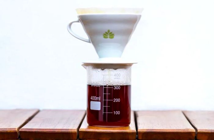 Closeup of coffee dripping into cup at Café Cultor in Bogotá