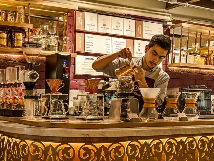 Barista pouring coffee at Cafe San Alberto in Colombia