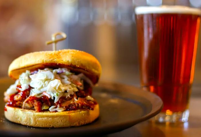 A pulled pork sandwich and a beer