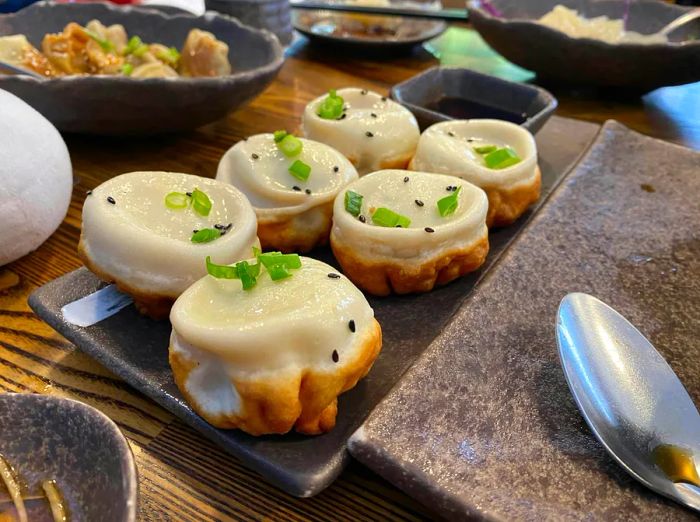 Savor the sheng jian bao dumplings at Dumpling Home in San Francisco