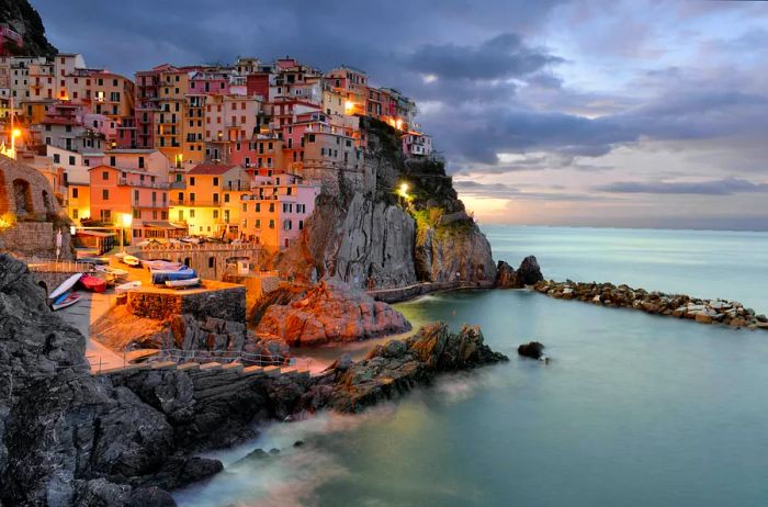 The vibrant townscape of Cinque Terre, with its colorful buildings hugging the coastline.