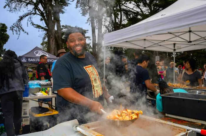 Chef Dontaye Ball preparing food at a Gumbo Social pop-up in San Francisco