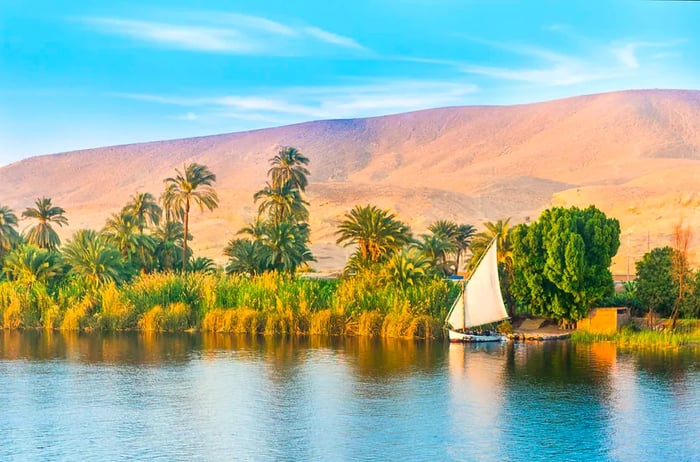 Sailing on the Nile River in a traditional felucca near Luxor, Egypt.