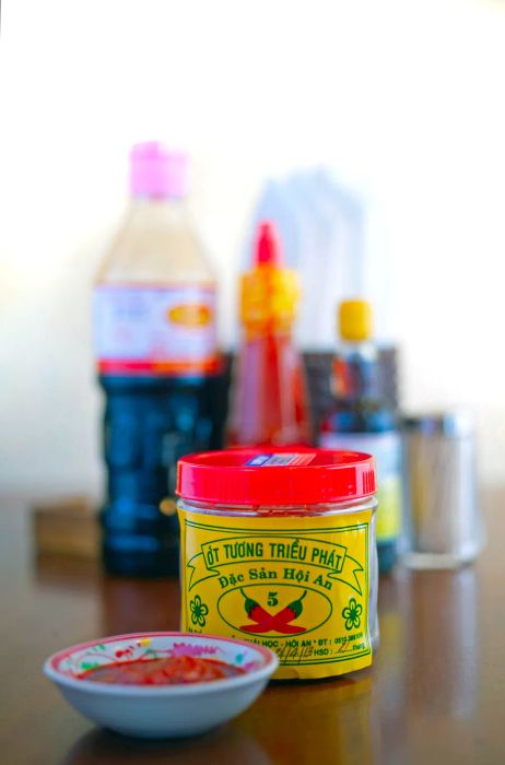 A jar of Ớt Tương Triều Phát chile sauce.