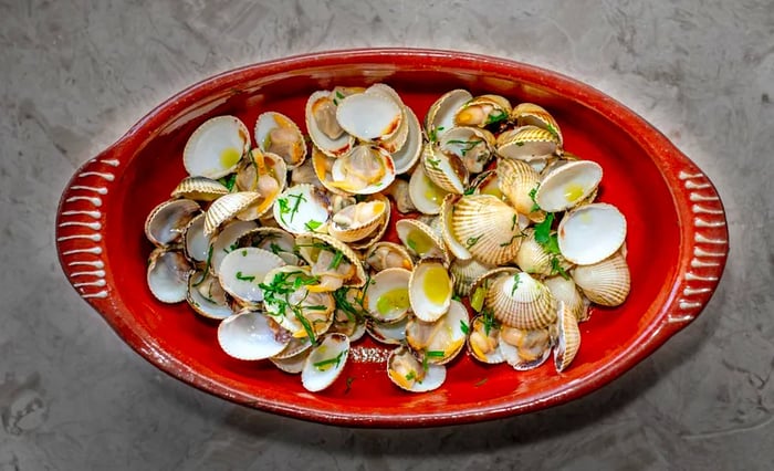 An aerial view of a plate featuring tiny clams.