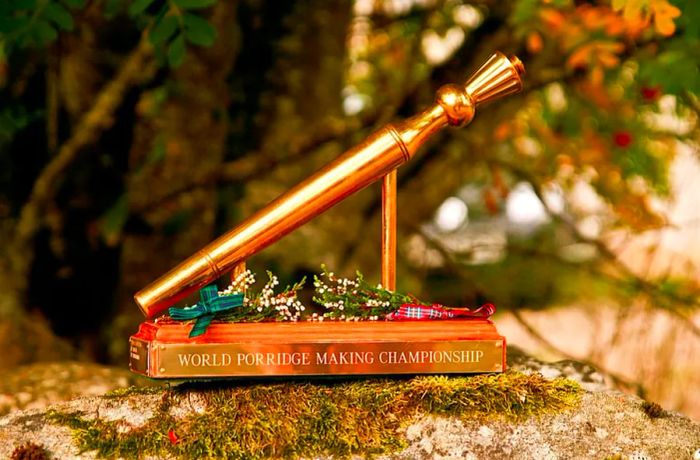 A golden trophy inscribed with “World Porridge Making Championship.”