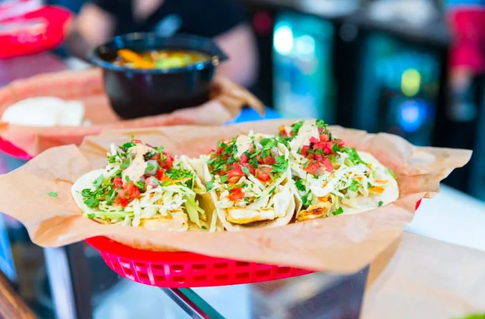 A plate featuring three delicious tacos.