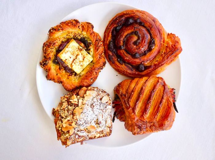 Aerial view of a plate featuring four assorted pastries