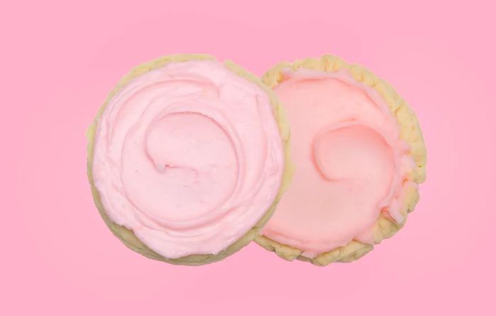 Two pink cookies displayed side by side.