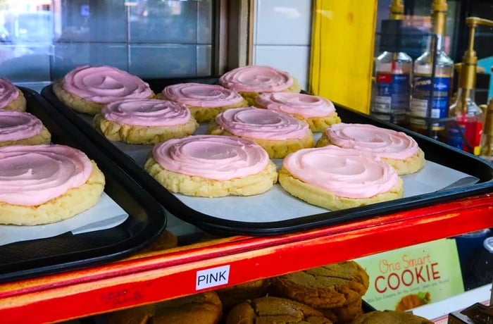 A tray of pink sugar cookies.