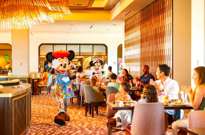 Mickey Mouse greets diners from nearby tables.