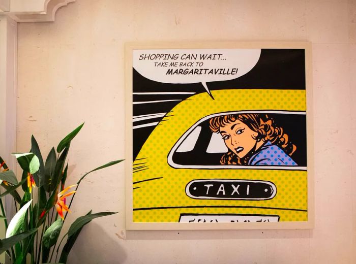 An artwork depicting a woman in a taxi with the phrase, “Shopping Can Wait, Take Me Back To Margaritaville!”