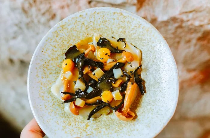 A delicate plate featuring mushrooms and seaweed