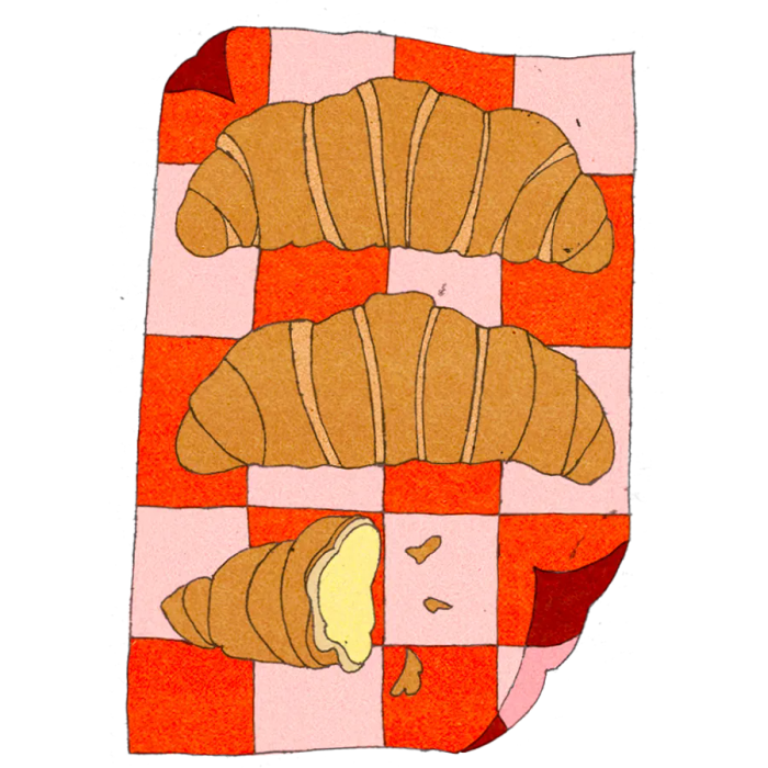 Illustration of three croissant-shaped pastries with one cut open, lying on a checked cloth.