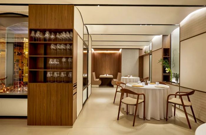 A dining area featuring white walls complemented by wood accents