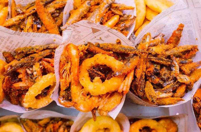 Fried shrimp and calamari served in newspaper cones.