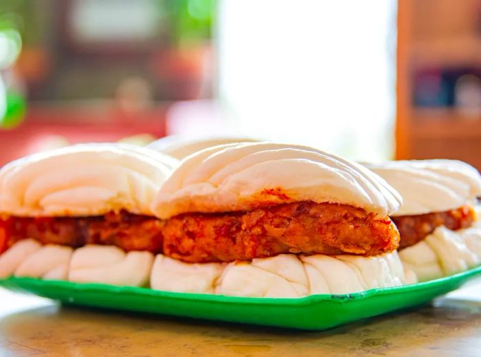 Fluffy steamed buns filled with fried fish sandwiches.