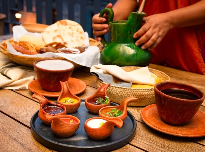 A selection of small terra cotta dishes arranged on a table.