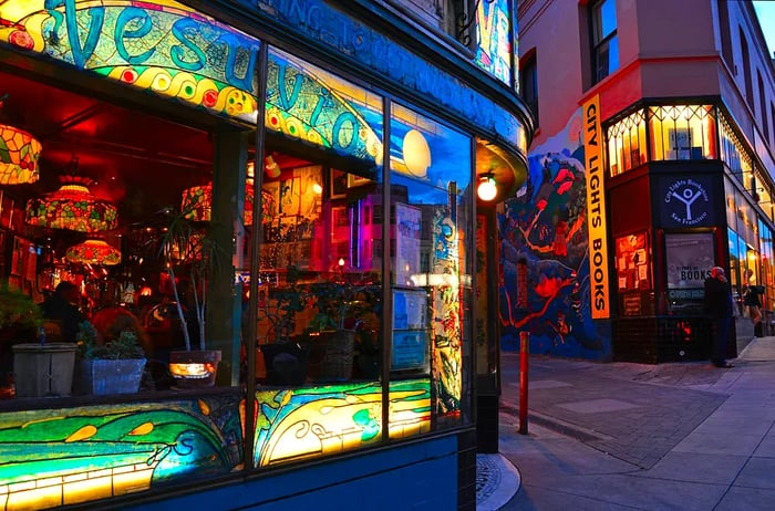 City Lights Bookstore and Vesuvio Cafe are iconic landmarks of the Beat Generation, located right next to each other in San Francisco.