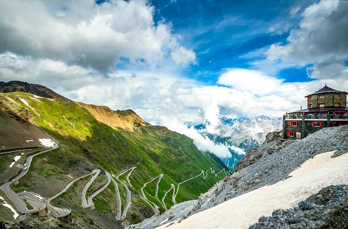 Aerial view of the winding hairpin turns of the Furka Pass in the Swiss Alps