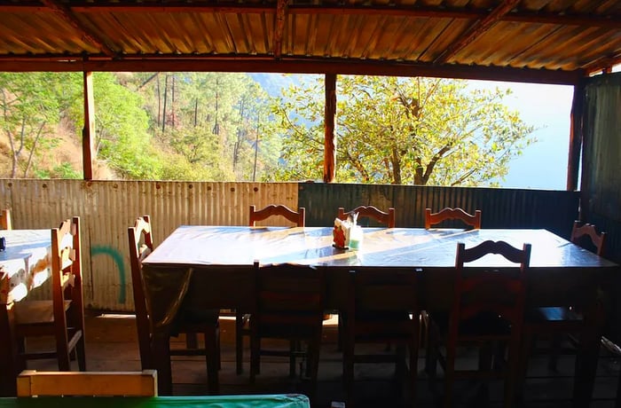 A sunlit table stands ready in the morning light.