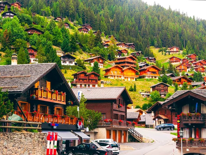 Charming chalets and traditional houses dot the hillside in the village of Grimentz, Valais