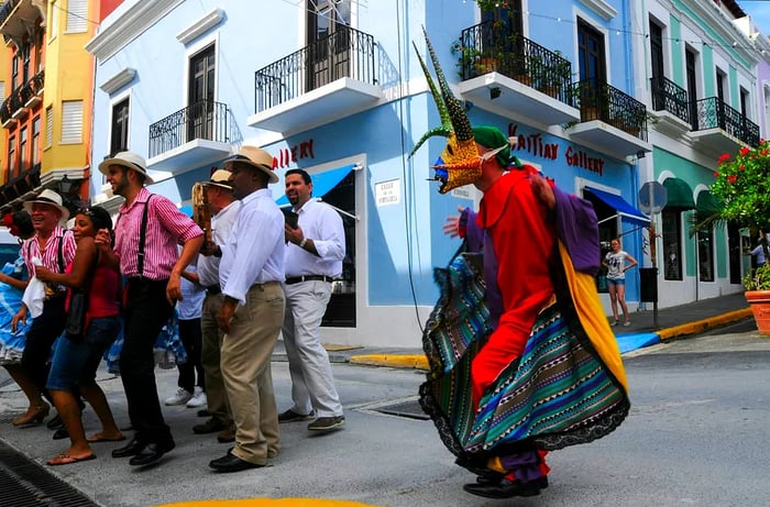 Traditional dancers fill the streets of San Juan, Puerto Rico with vibrant celebrations.