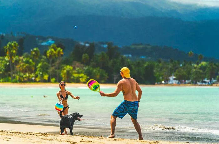 A couple enjoys a day at the beach in Luquillo, Puerto Rico.