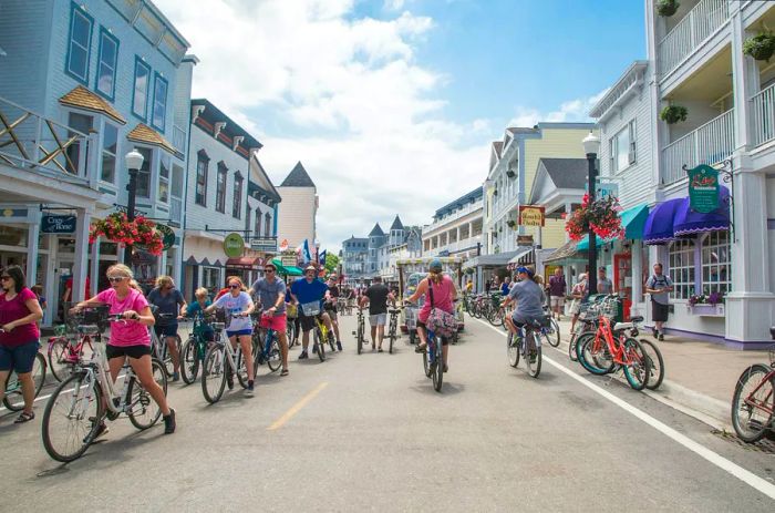 A pedestrian-friendly street bustling with people of all ages riding bicycles