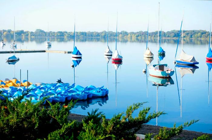 Tranquil small sailboats moored on a serene lake