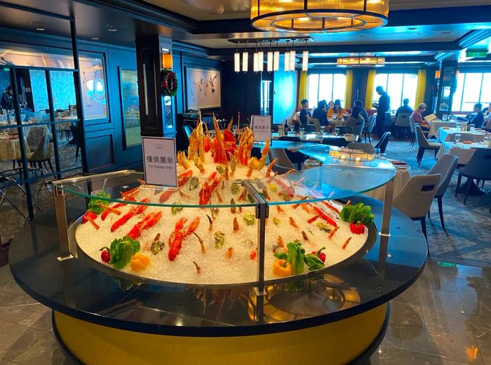 A chilled seafood presentation in a spacious dining area of the cruise ship.