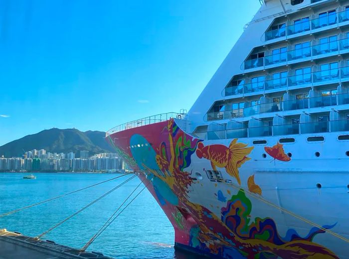 A cruise ship anchored in a tranquil bay.