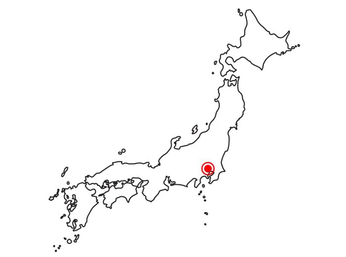 A map of Japan featuring a red dot marking the location of Tokyo.